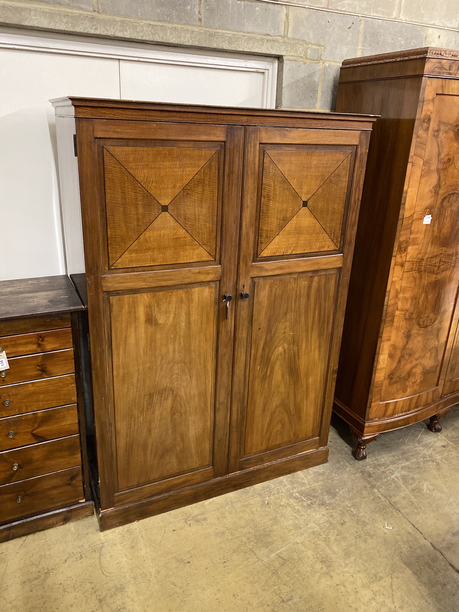 An early 20th century Heal & Son mahogany compactum wardrobe, width 127cm, depth 56cm, height 179cm